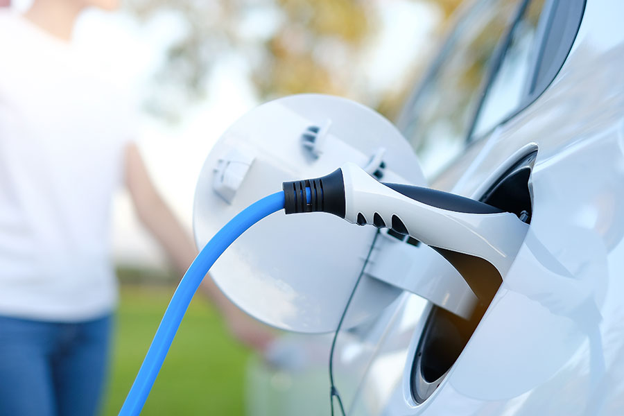 Picture of EV charger plug charging car